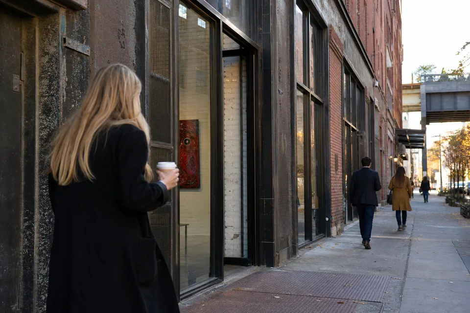 A street of former warehouses with gallery storefronts on the far west side of Manhattan on a weekday afternoon